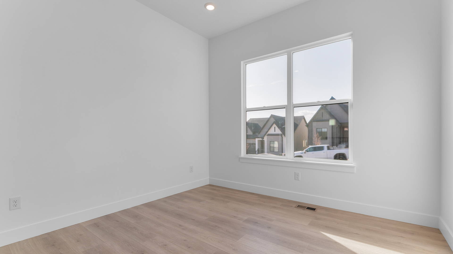 Bedroom with large window.
