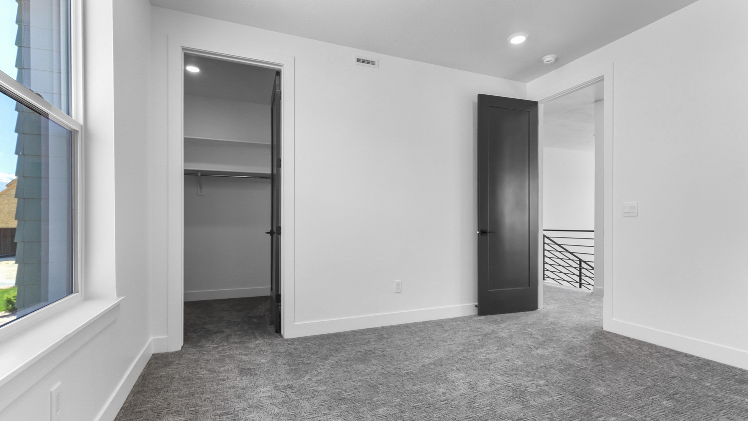 Bedroom with large window.