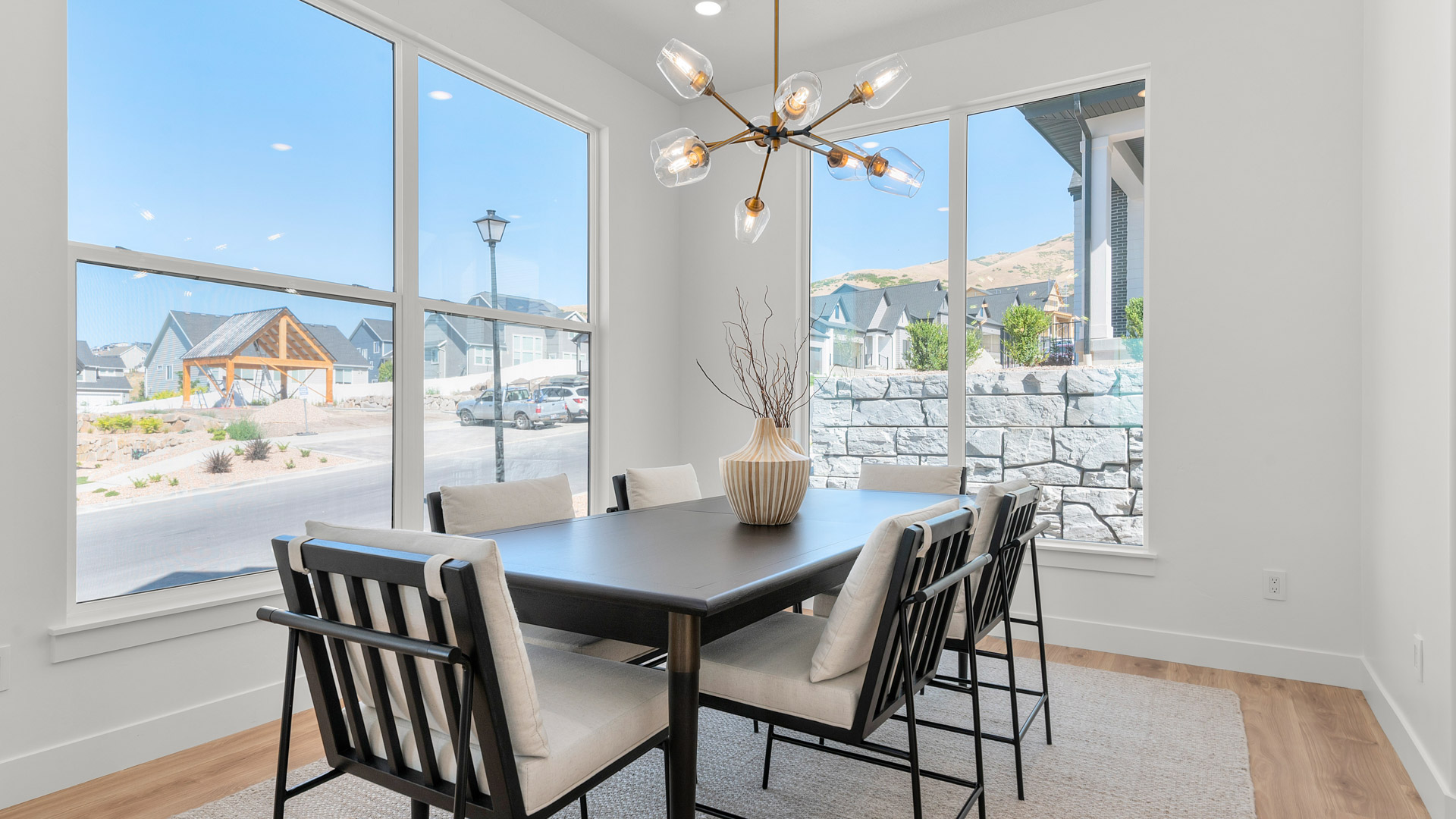 Dining room in front of home with windows.