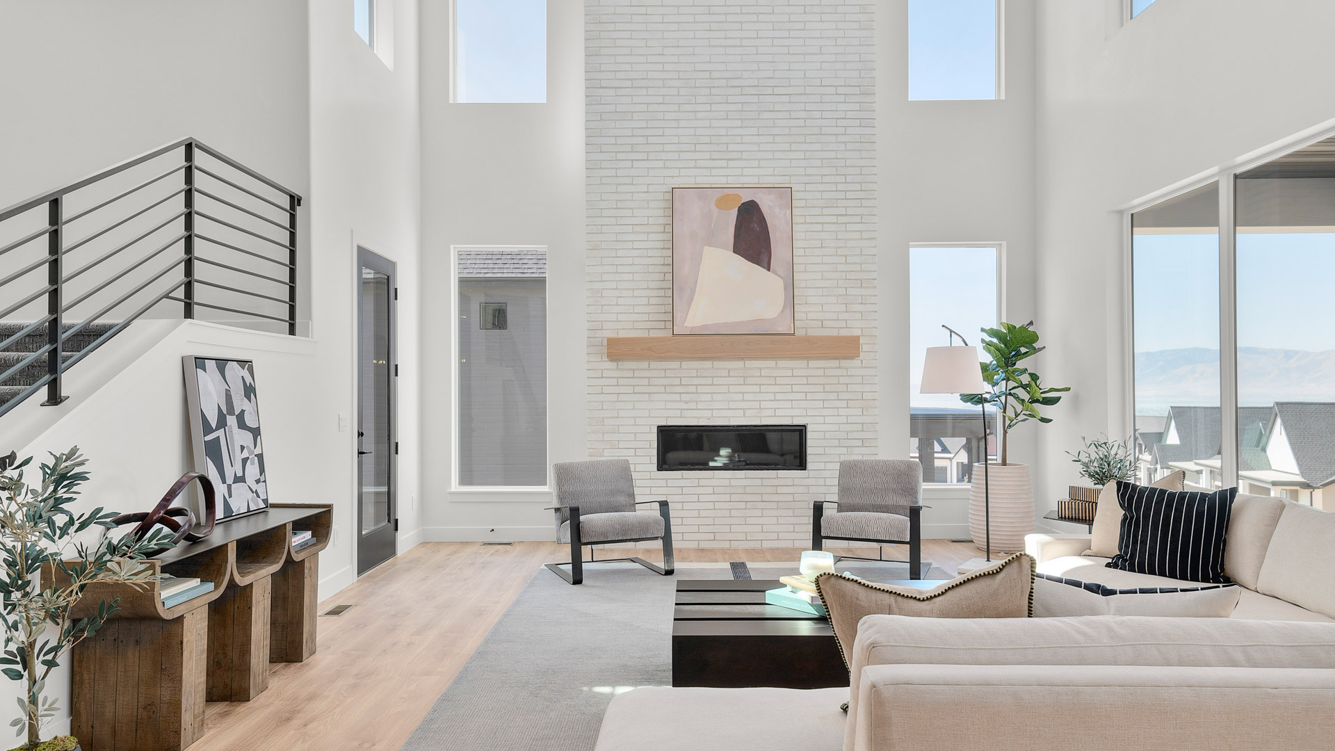 Two-story living room with fireplace.