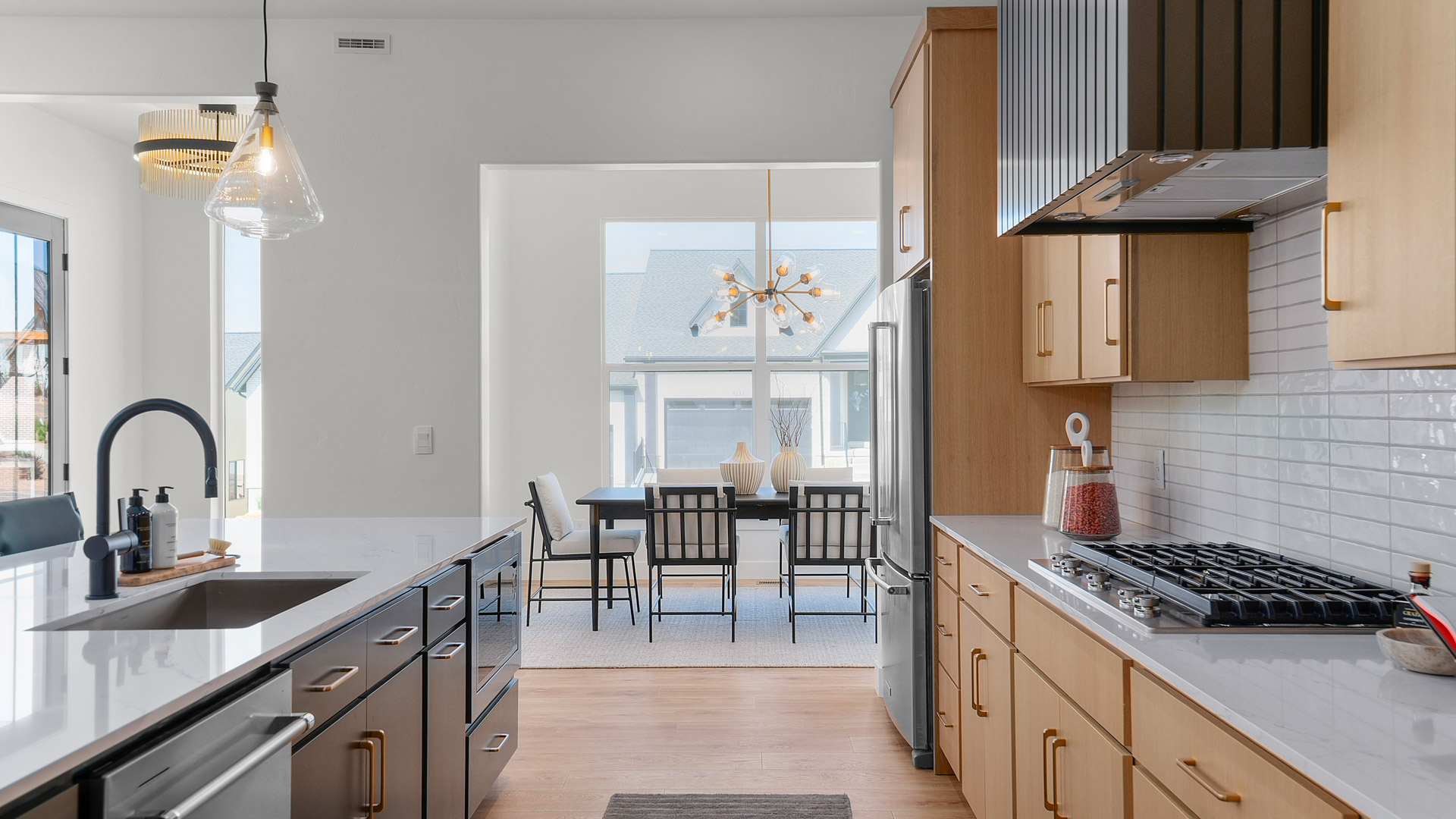 Kitchen with large kitchen island, cabinets, stainless steel appliances.