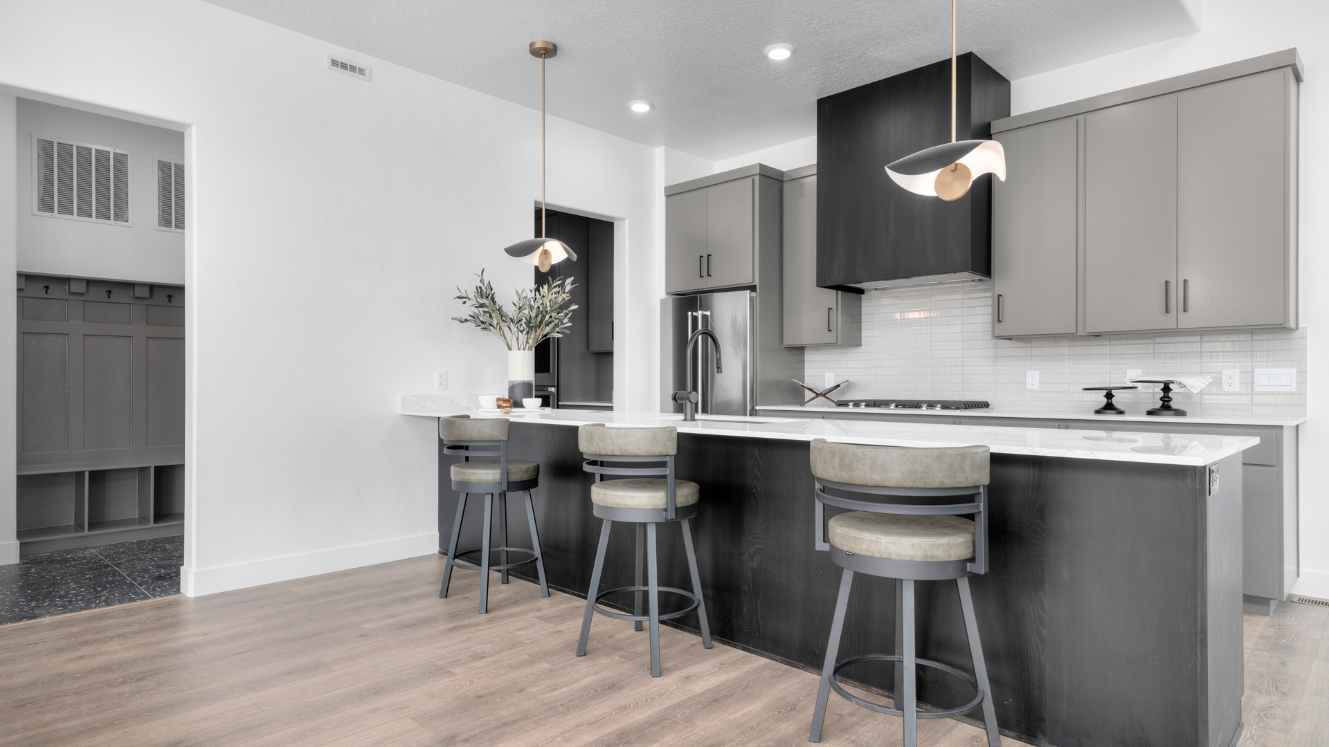 Kitchen with attached island and stainless steel appliances.