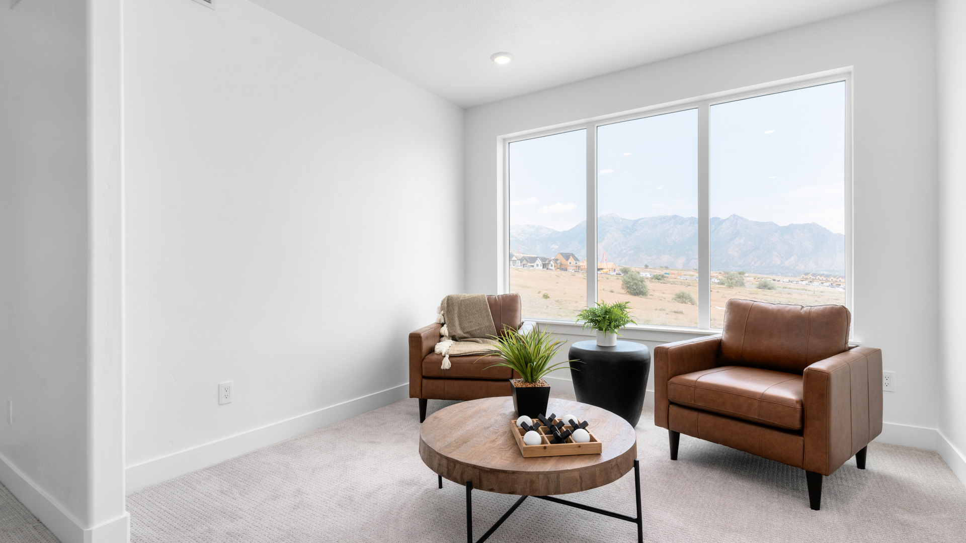 Loft space upstairs with large window.