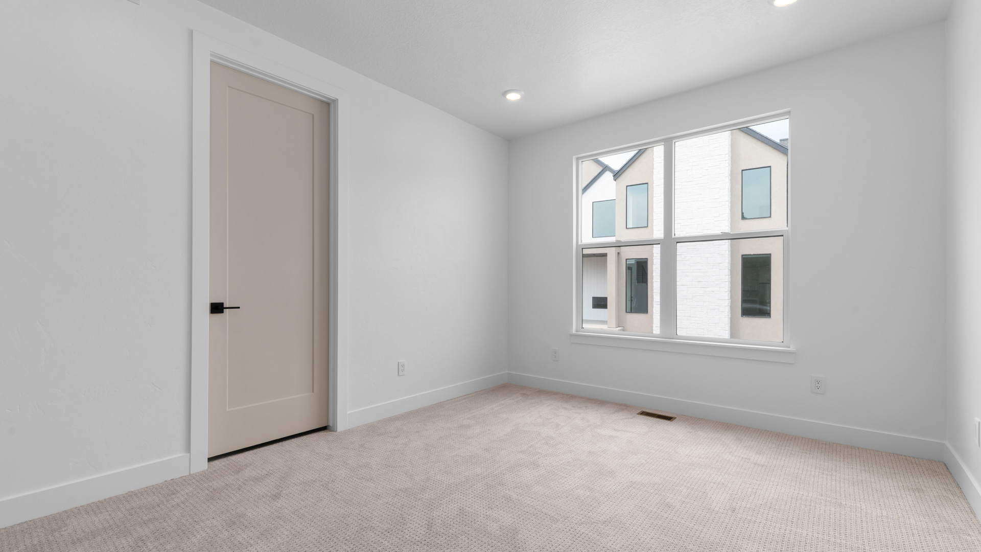 Bedroom with large window.