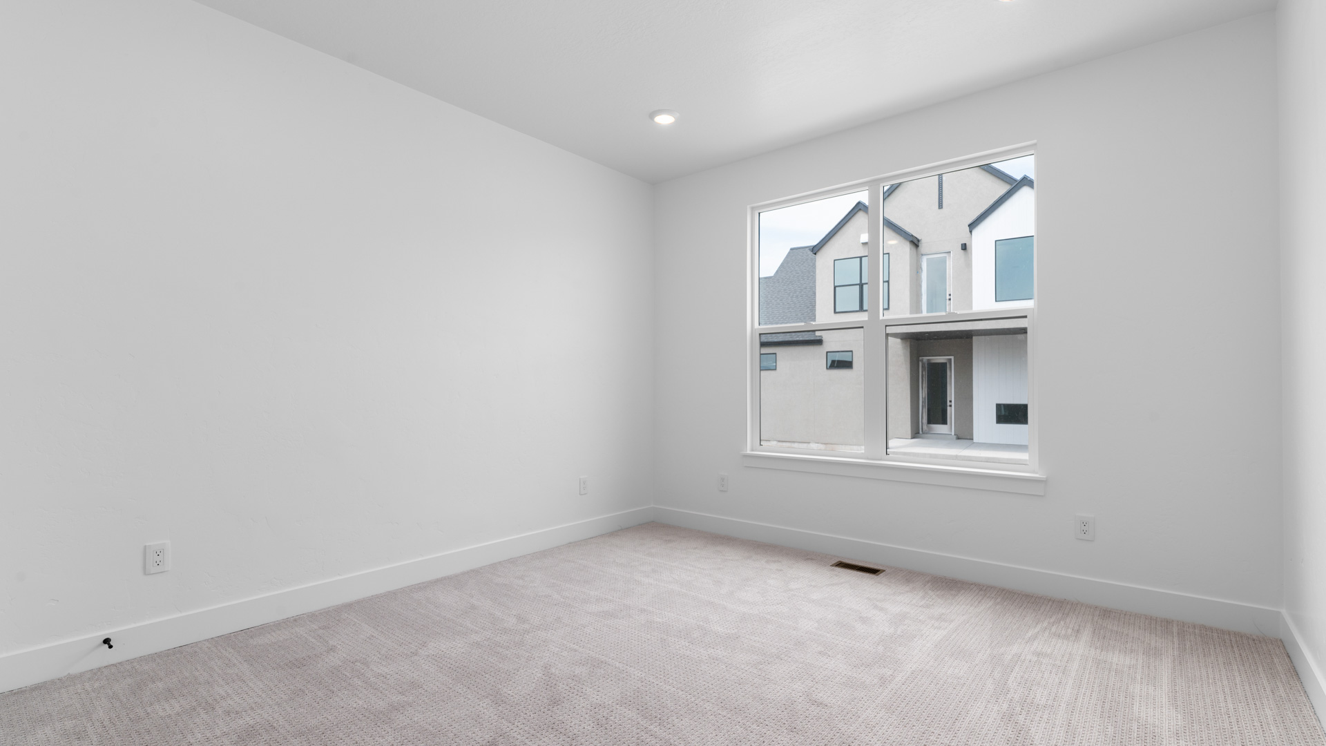 Bedroom with large window.