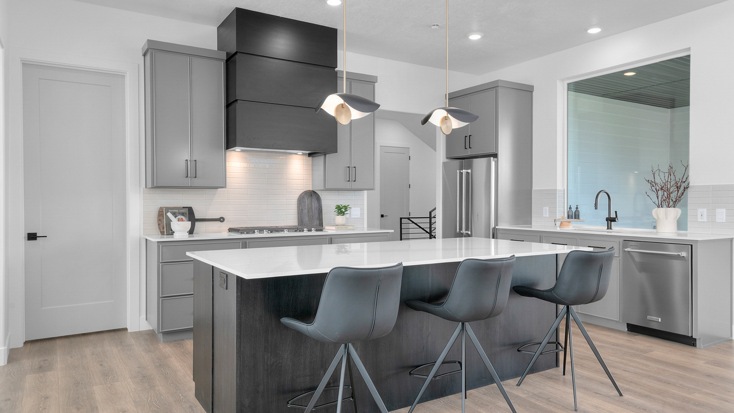 Kitchen with large kitchen island featuring stainless steel appliances.