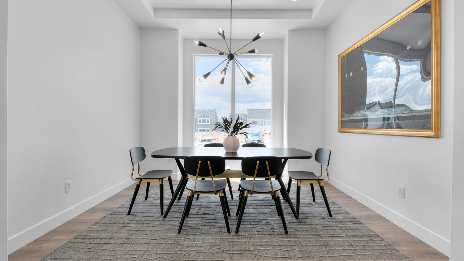 Spacious dining room with large window.