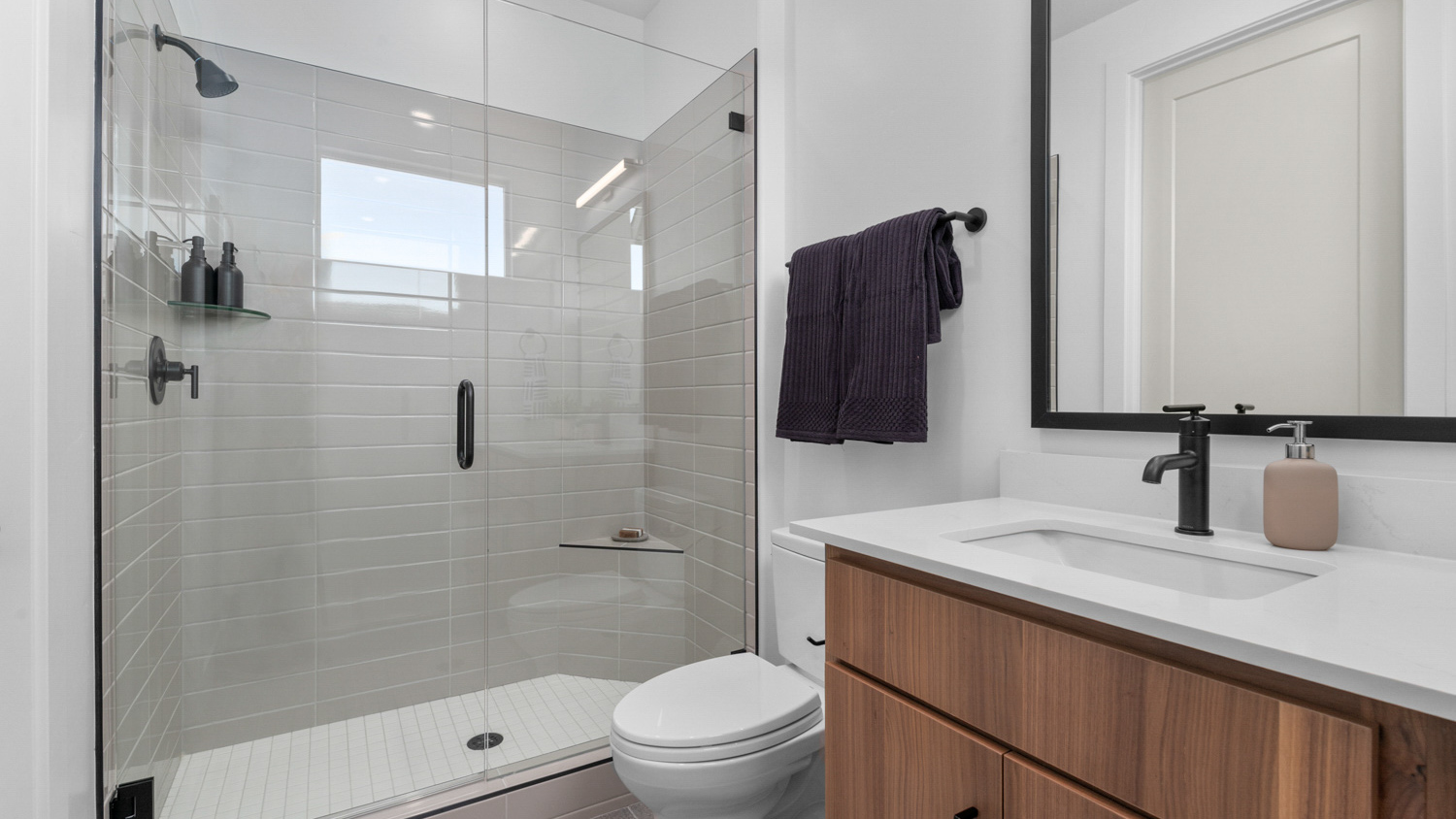 Bathroom with glass shower doors.