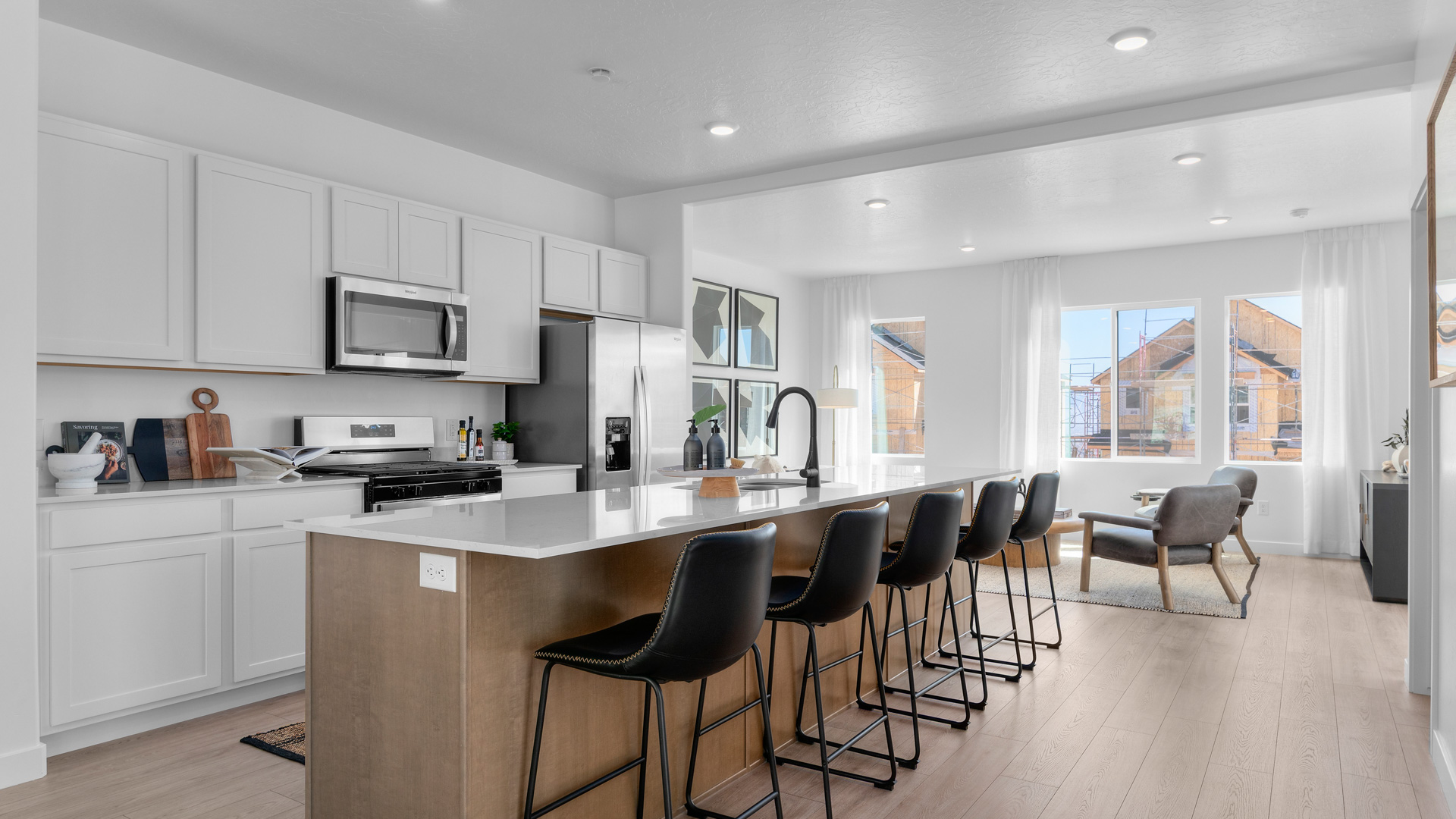 Kitchen with large kitchen island and stainless steel appliances.