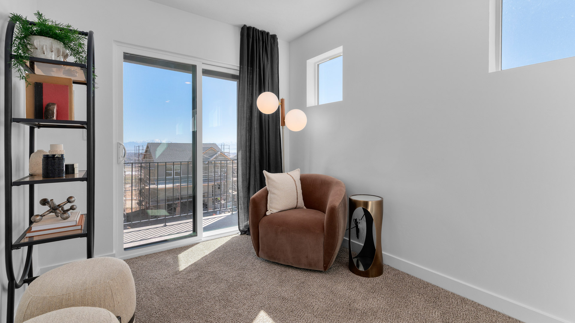 Loft space with windows and deck doors.