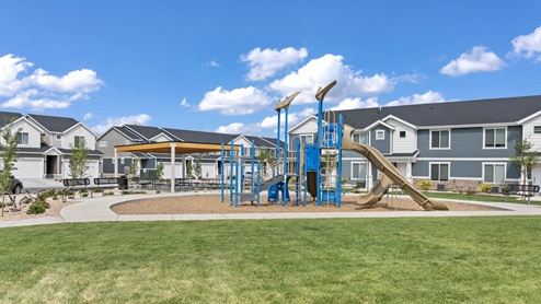 Amenities include a playground for children to play.