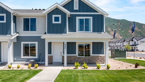Dalton farmhouse exterior elevation with landscaping in Spanish Fork Utah.