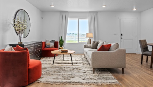 Living room off the entry with large window.
