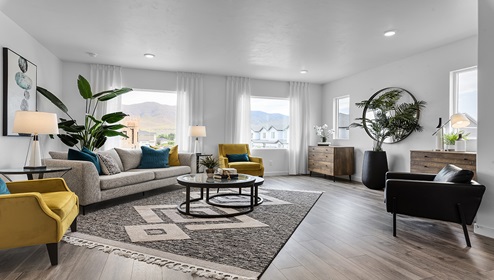 Spacious living room with four large windows in a townhome in Eagle Mountain Utah.