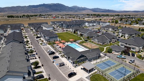 Aerial photo of D.R. Horton’s Eagle Point Townhomes community with club house and community pool.