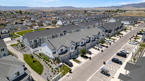 Aerial photo of D.R. Horton’s Eagle Point Townhomes community with club house and community pool.