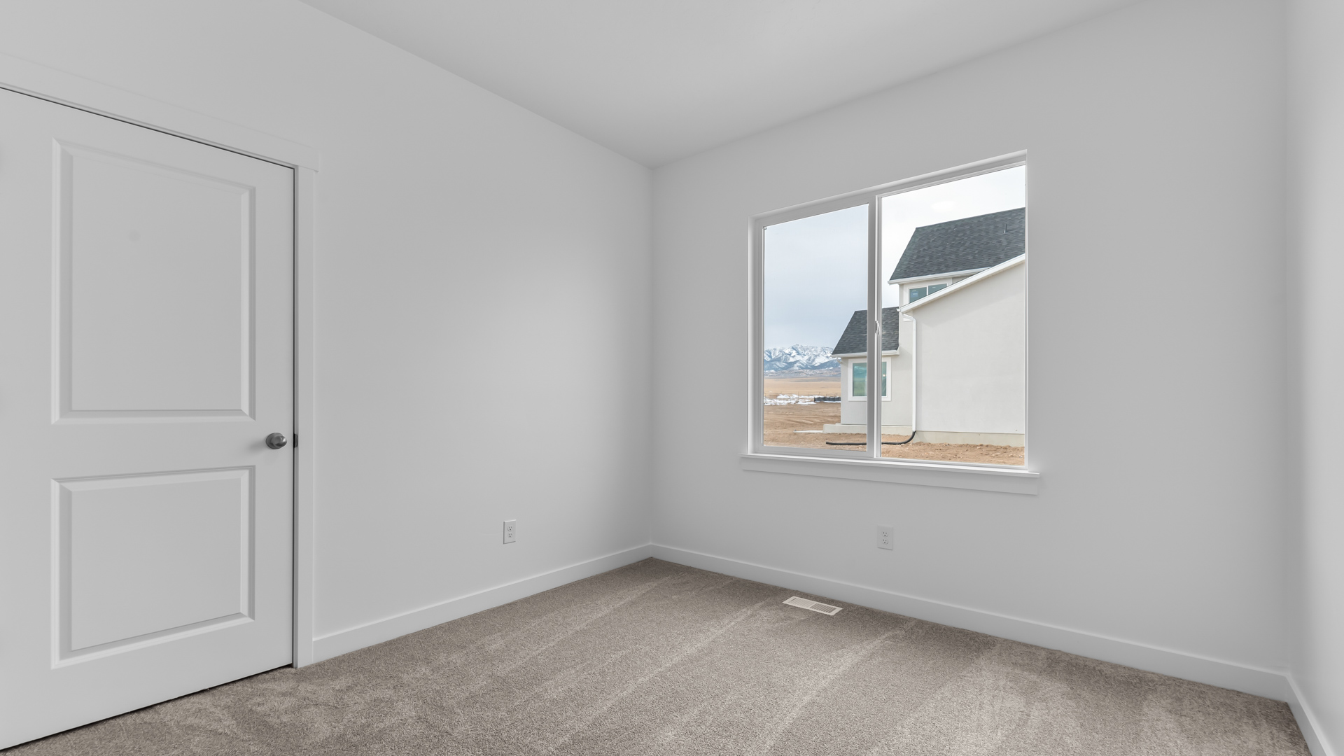 Bedroom with large window.