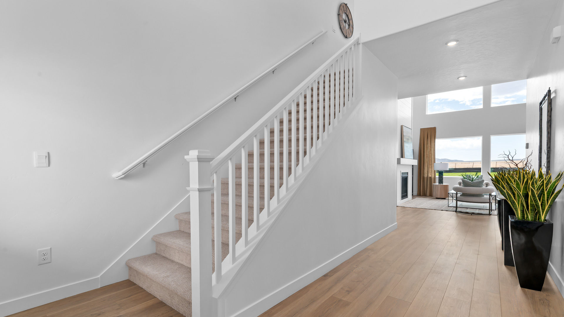 Wide open staircase at the home entry