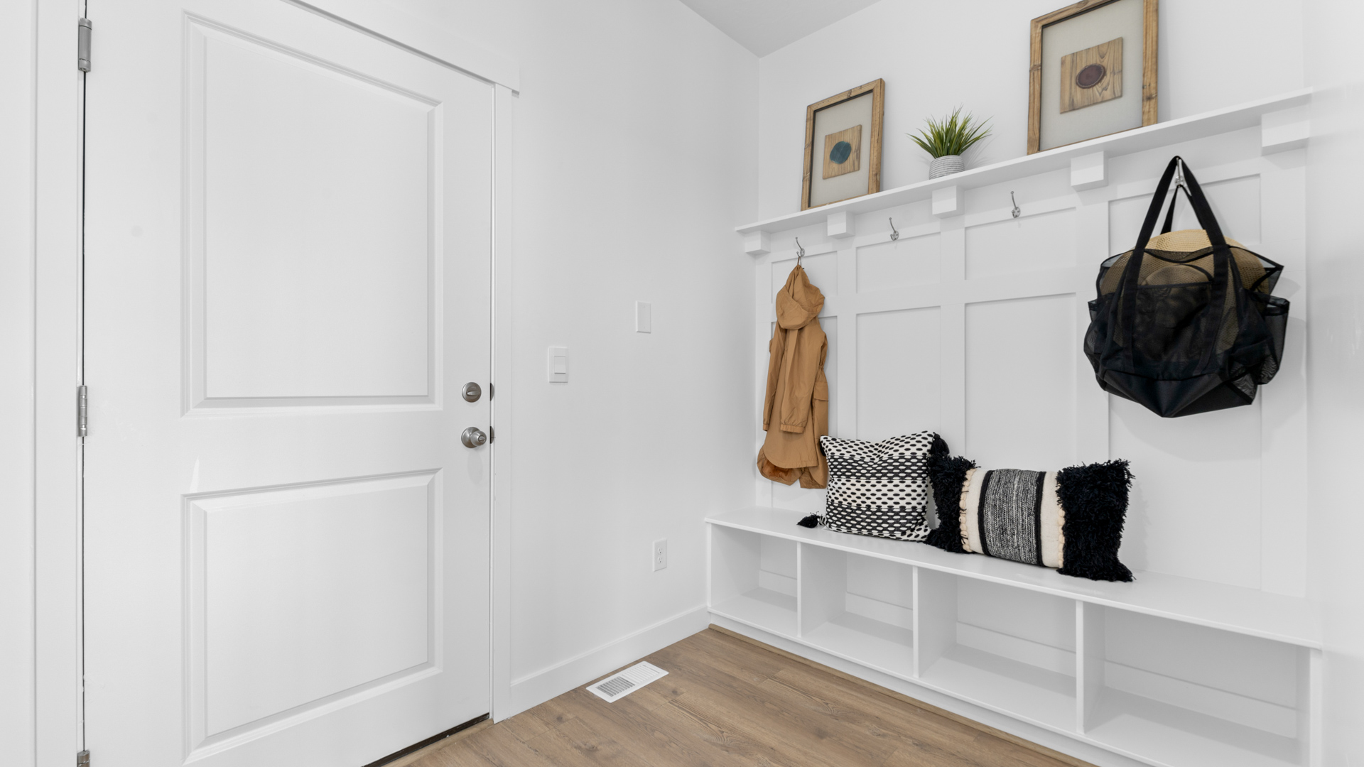 Mudroom area with mudroom bench.