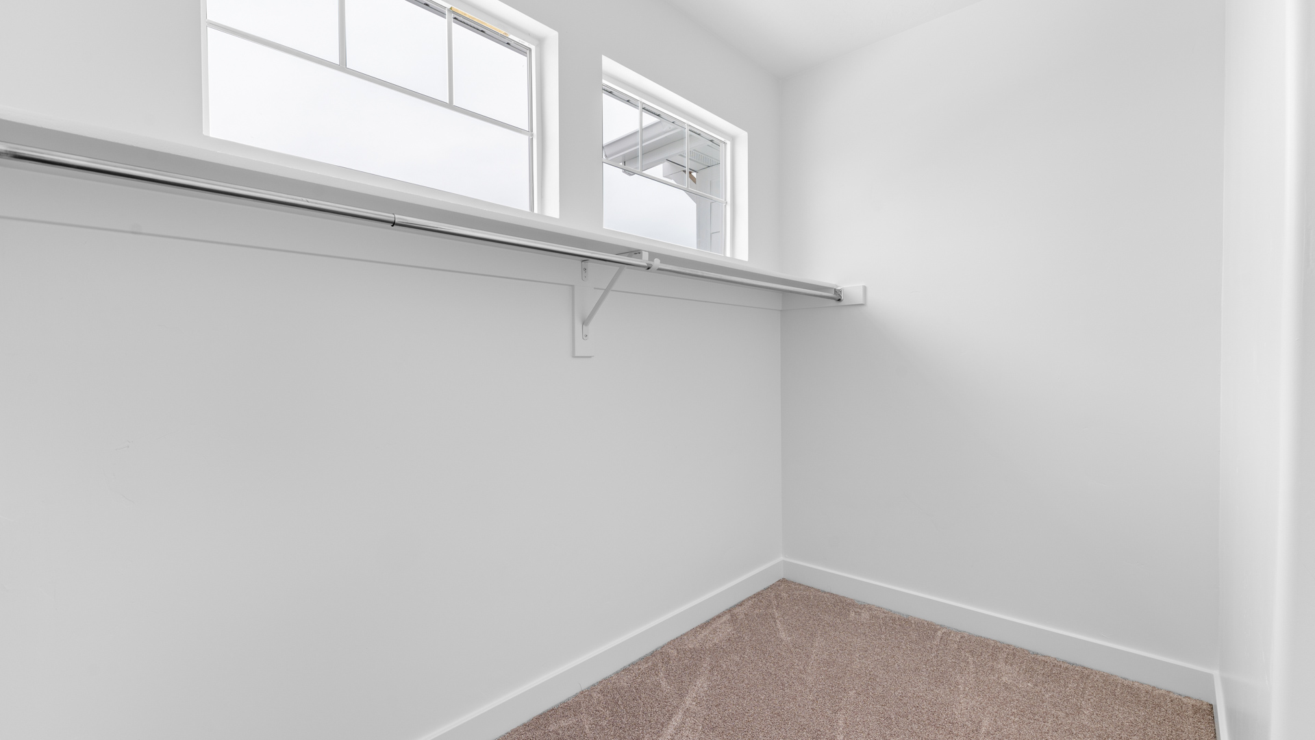 Walk-in closet with windows.