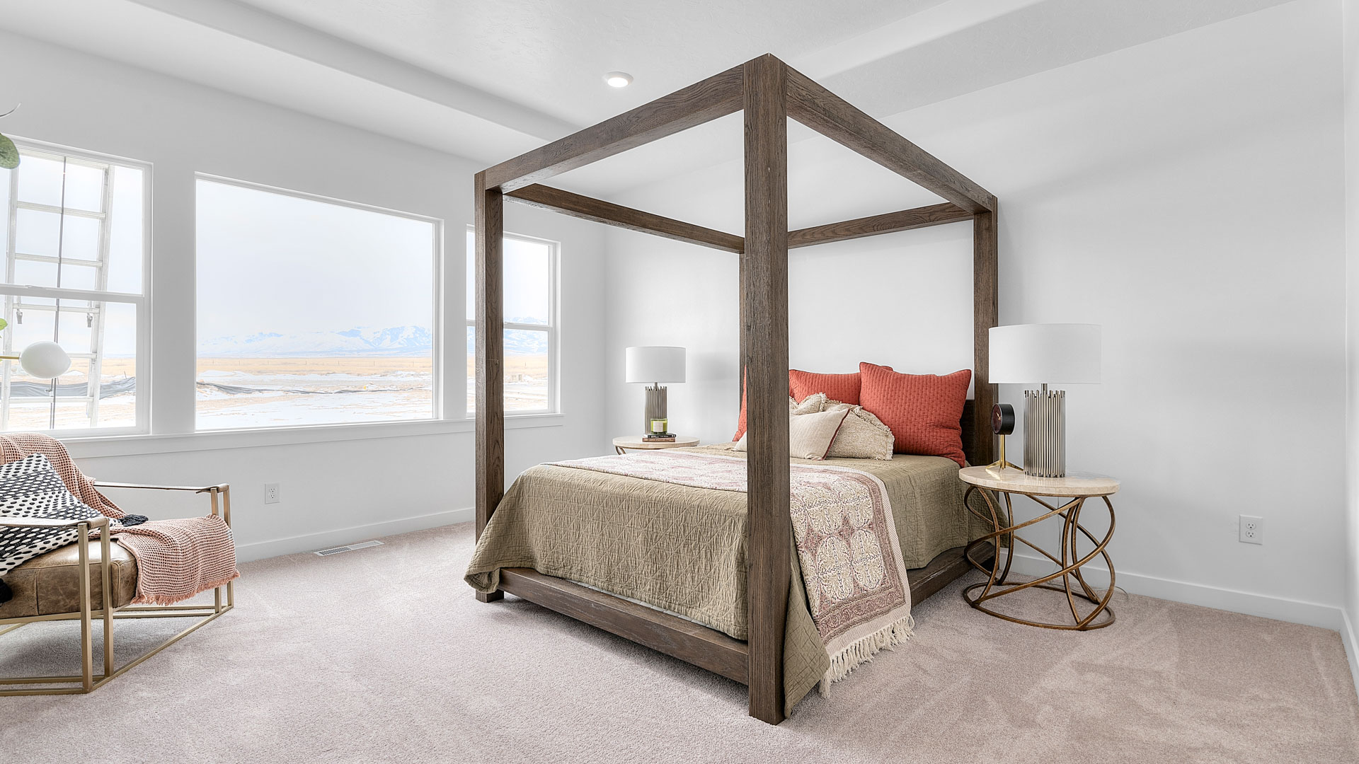 Large primary bedroom with windows for natural light.