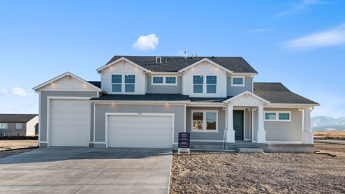 Brand new single story home in Grantsville with a three car garage