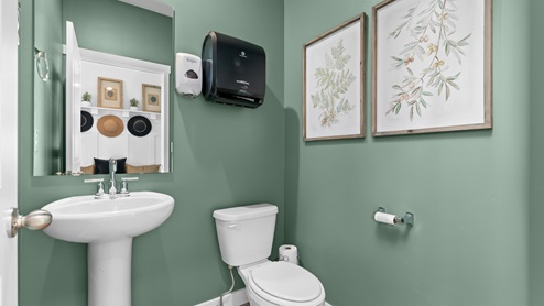 Powder bathroom with pedestal sink.
