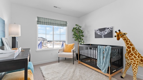 Bedroom with large window.