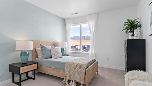 Bedroom with large window.