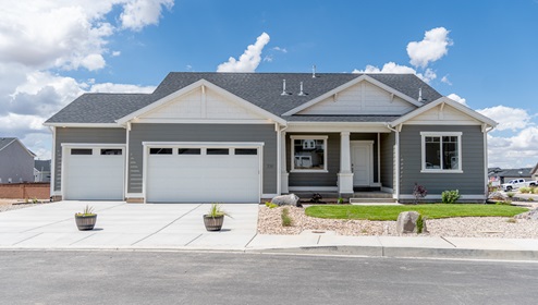 Brand new single story home in Grantsville with a three car garage