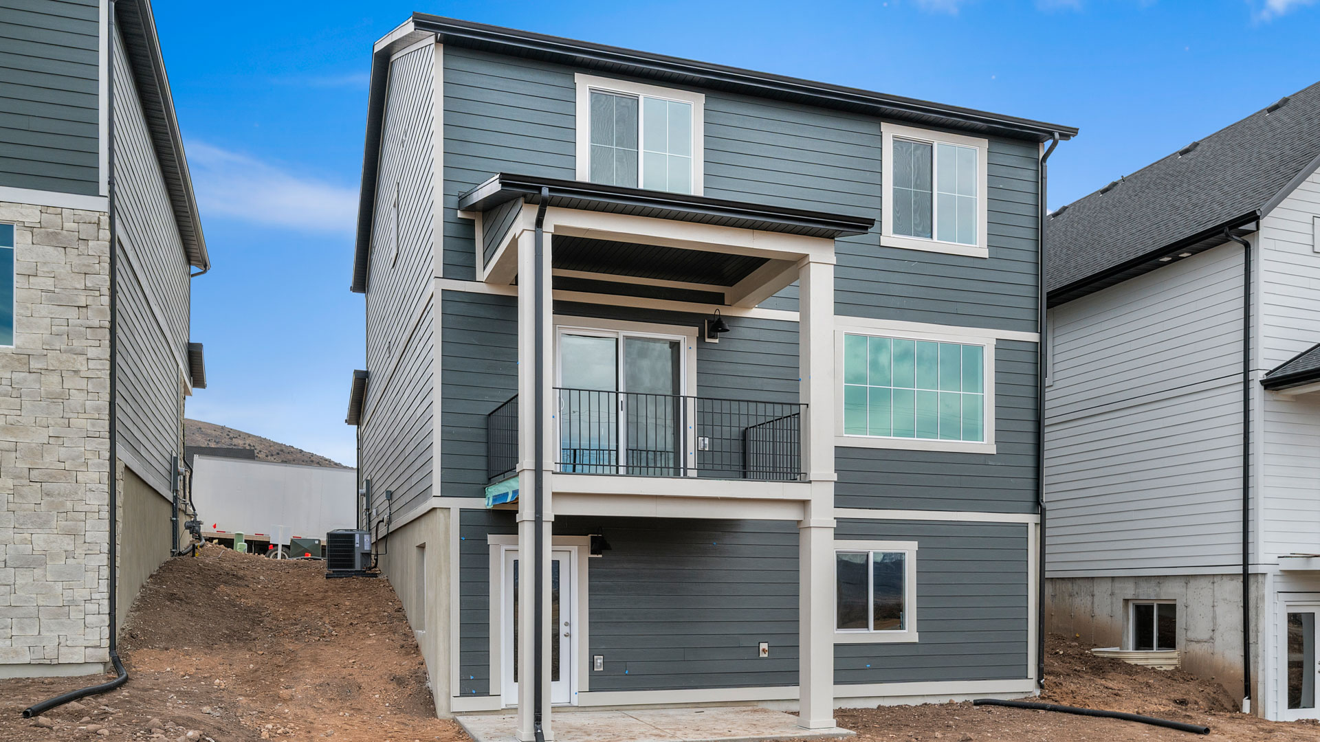 Back of home with walkout basement.