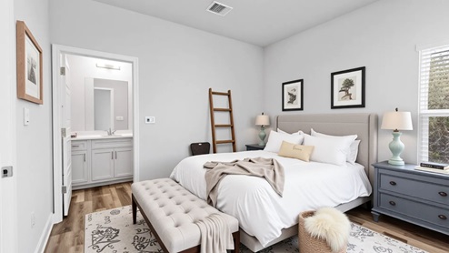 Bright and airy guest bedroom, accented with luxurious neutrals.