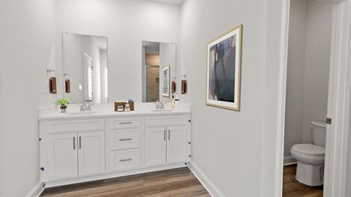 Spacious and bright primary bathroom vanity.