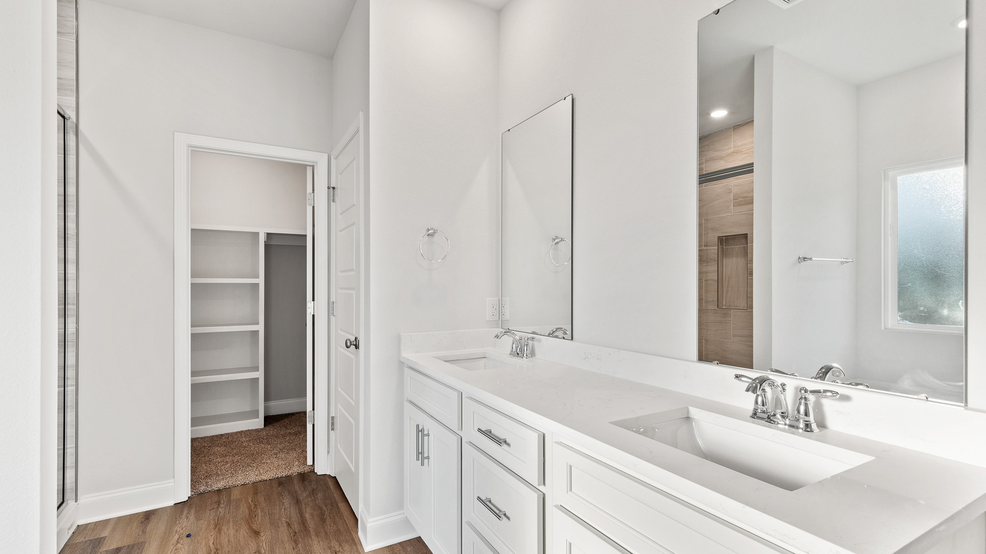 Spacious and sleek primary bathroom