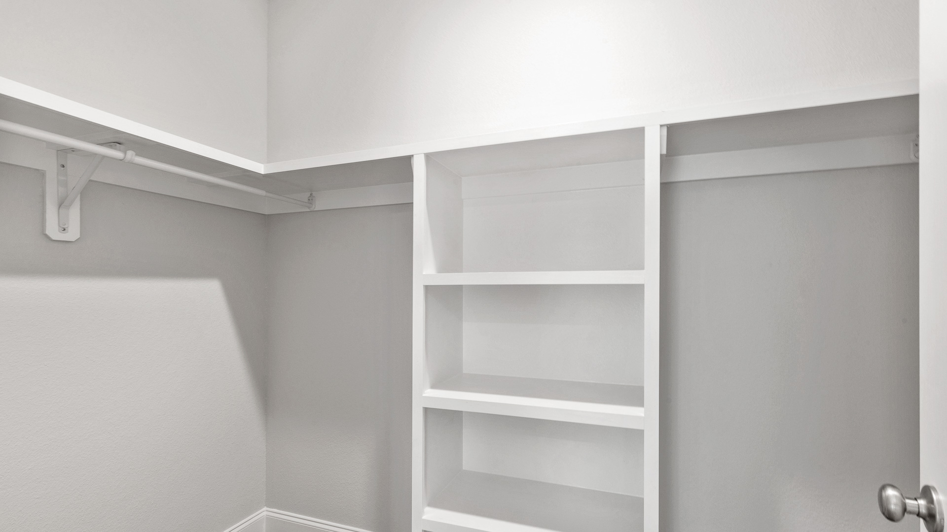 Luxurious and airy primary bedroom closet