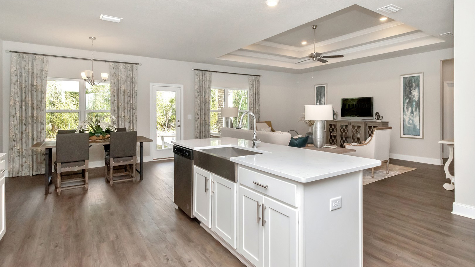 An oversized family area connects effortlessly with the kitchen and dining spaces in this new home on the Gulf Coast.