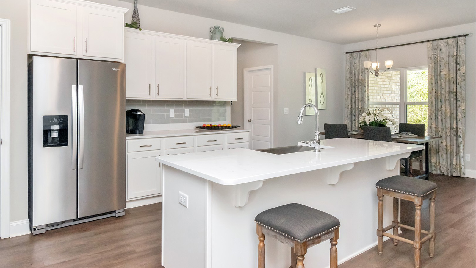 The walk-in pantry and stylish finishes make this kitchen a standout in this D.R. Horton home.