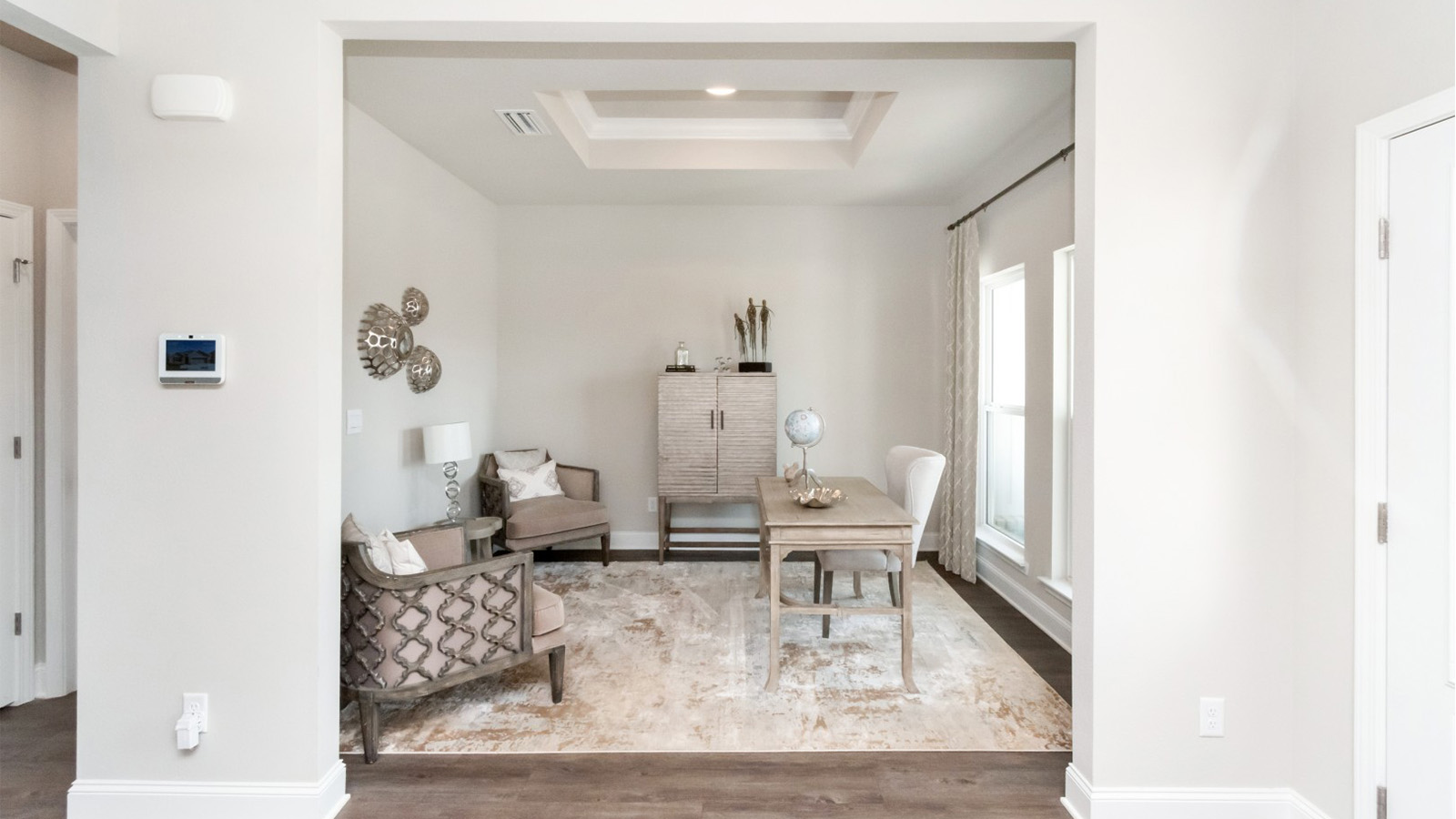 Flex room off of the entry way, furnished as a study in Palm Pointe.