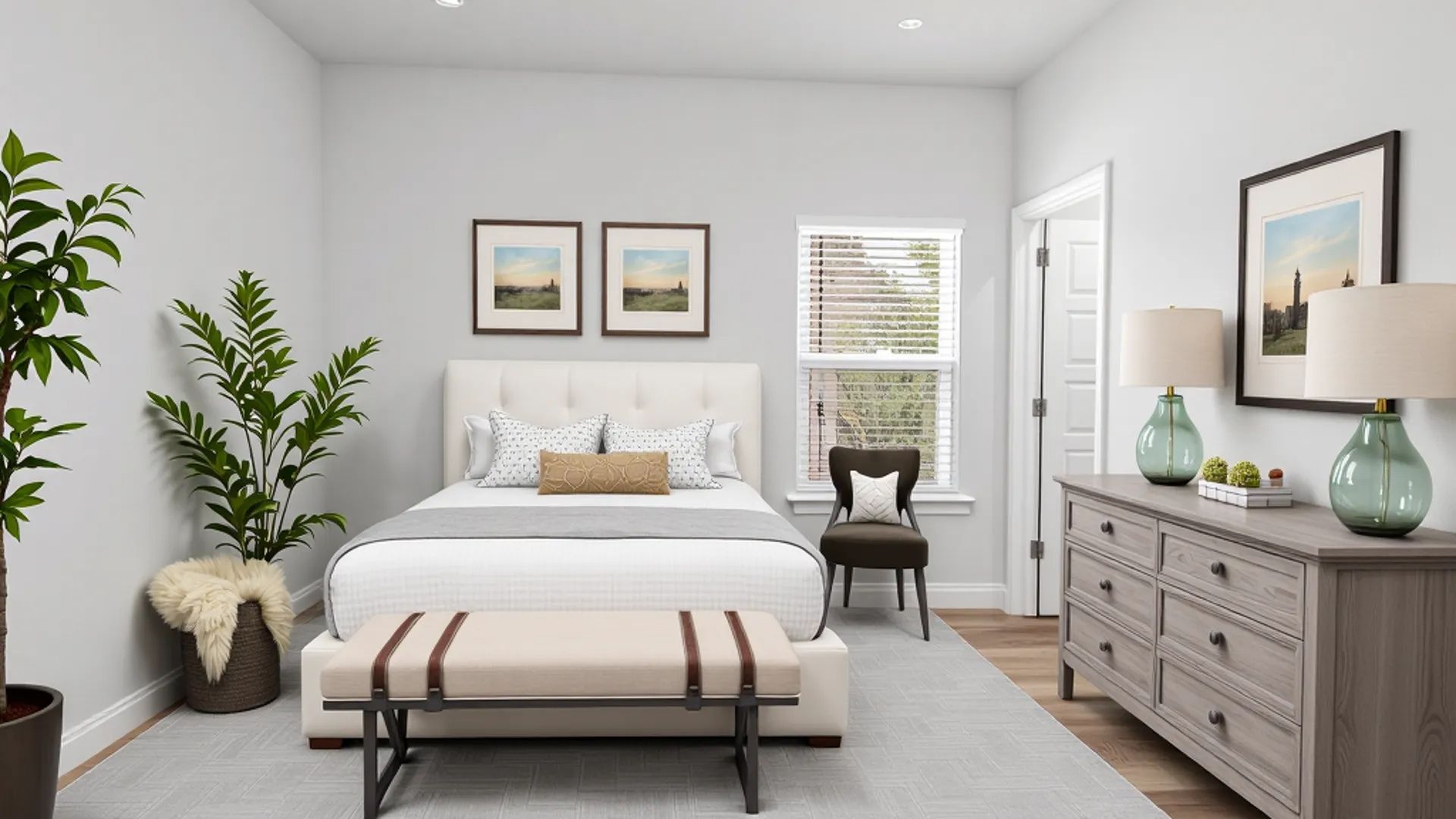 Spare bedroom with neutral bedding in a new home community on the MS Gulf Coast.