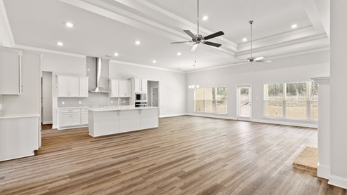 Open floorplan with high ceilings and fan in Palm Pointe.