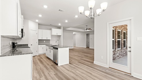 Open floor layout in kitchen and dining area