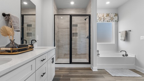 Primary bathroom with luxurious black finishes.