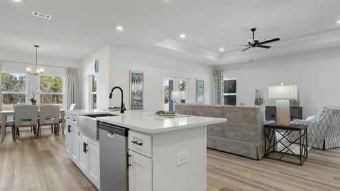 Open floorplan of kitchen, living area, and dining area.