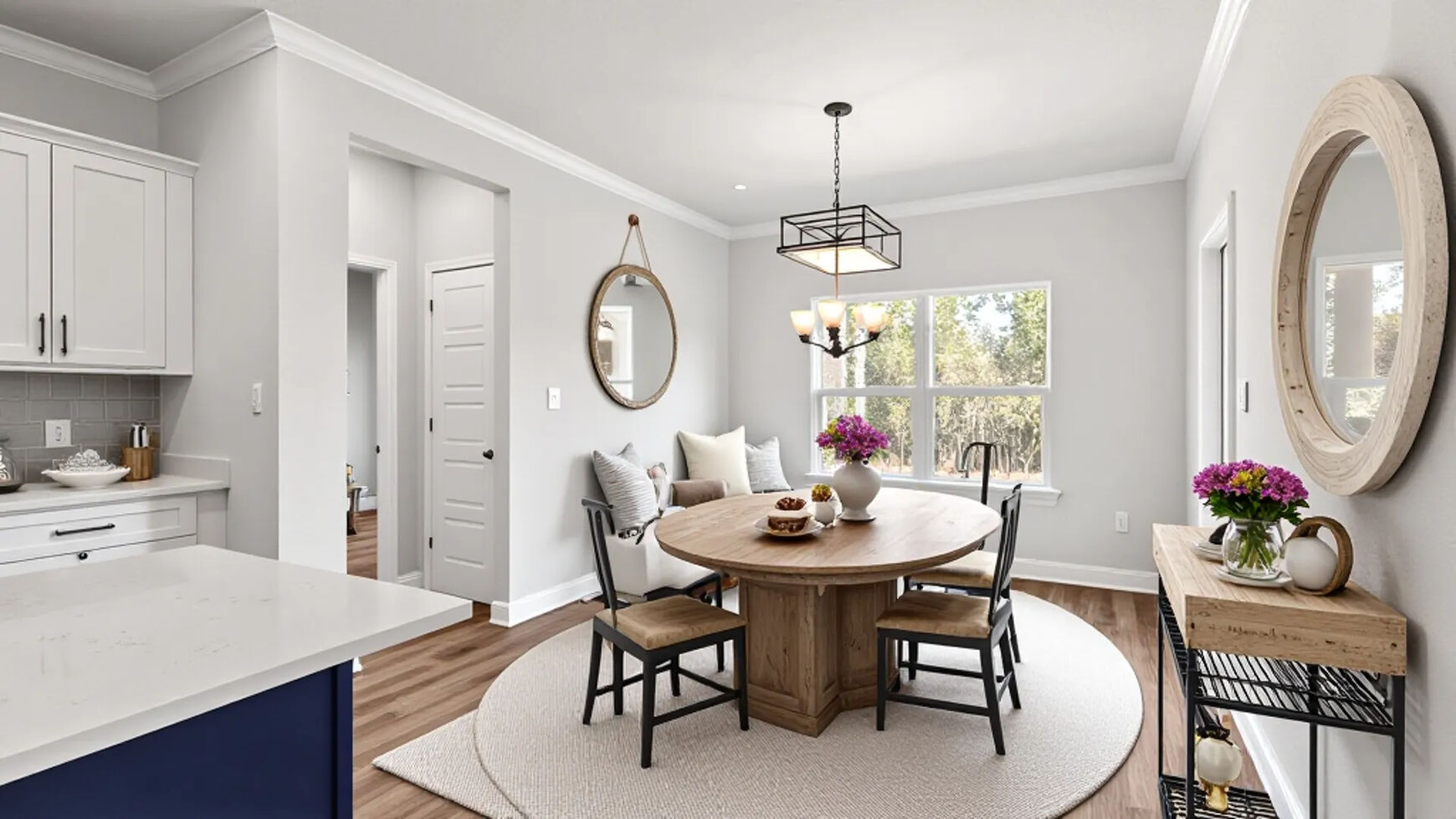 Breakfast nook with round table off of the kitchen in a new Mila floorplan in Gulfport.