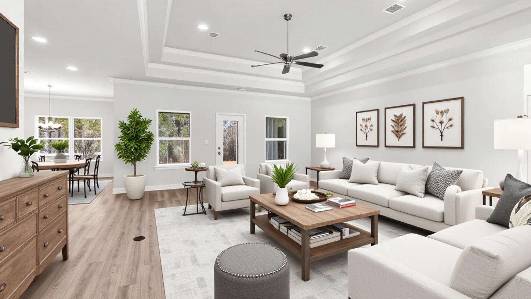 The Mila living area with neutral farmhouse inspired furnishings in River Hills.