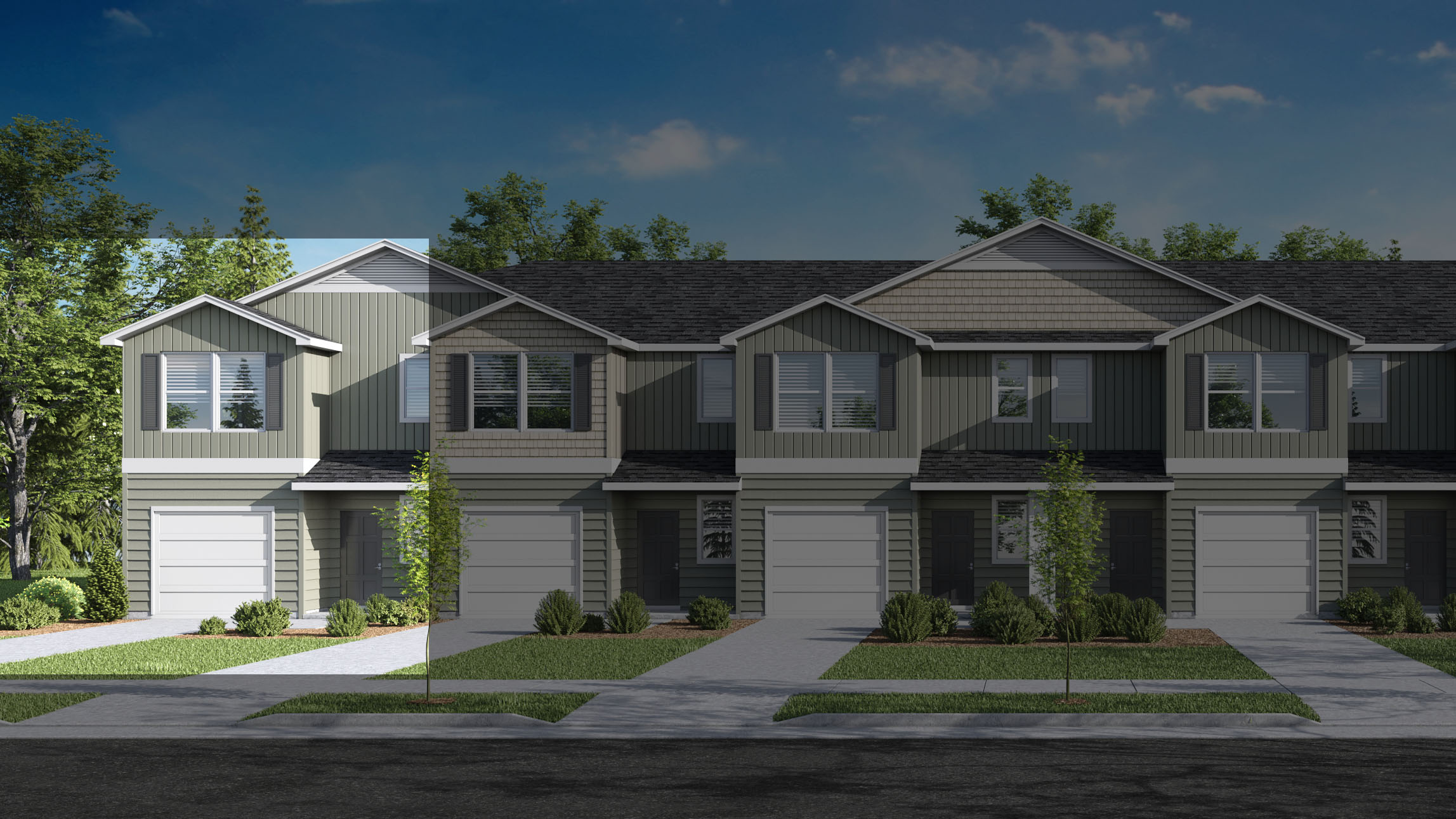 View of townhomes with neutral exteriors and paved driveways.