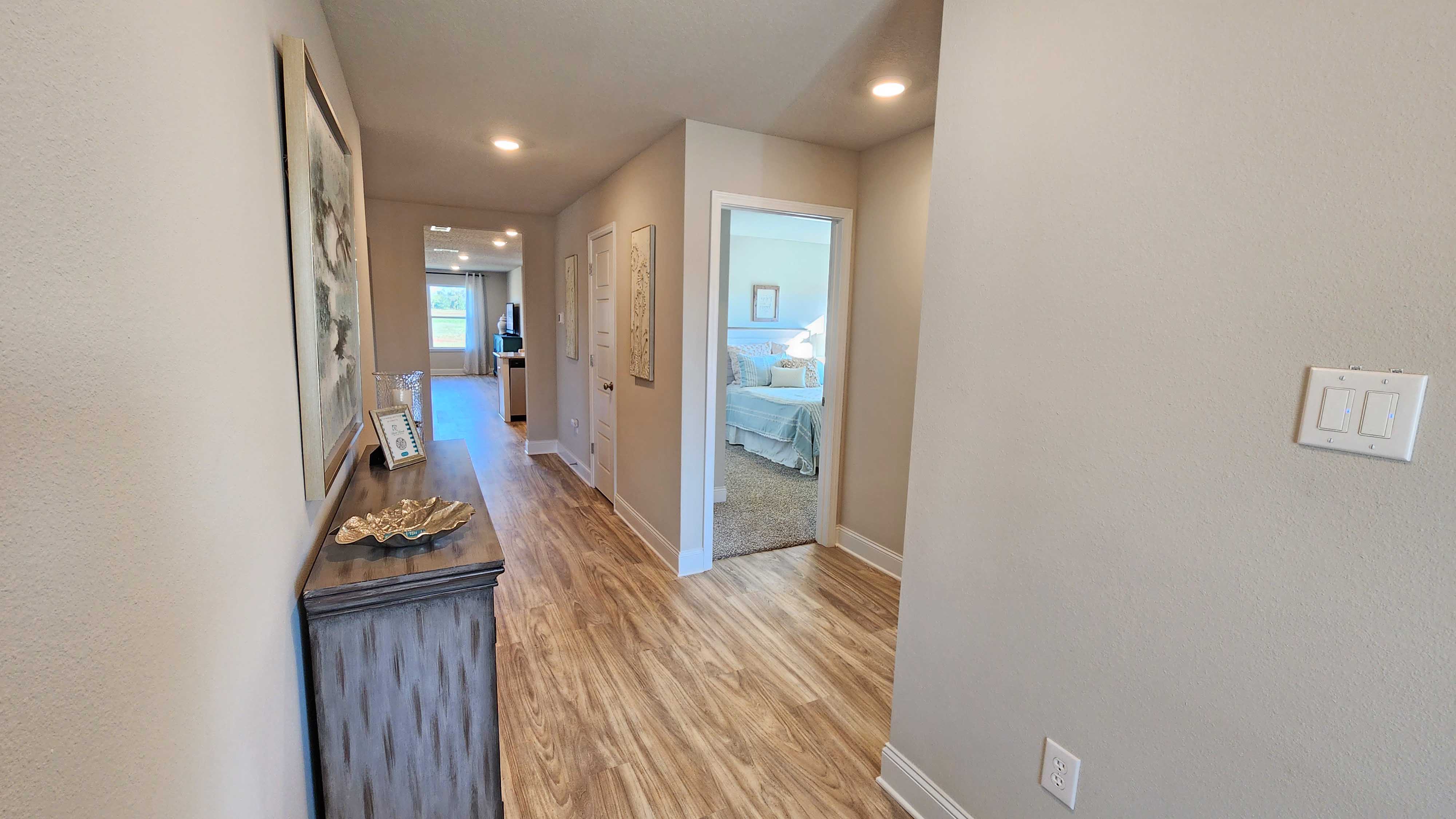 The foyer to the home with views of the bedrooms and bathroom.