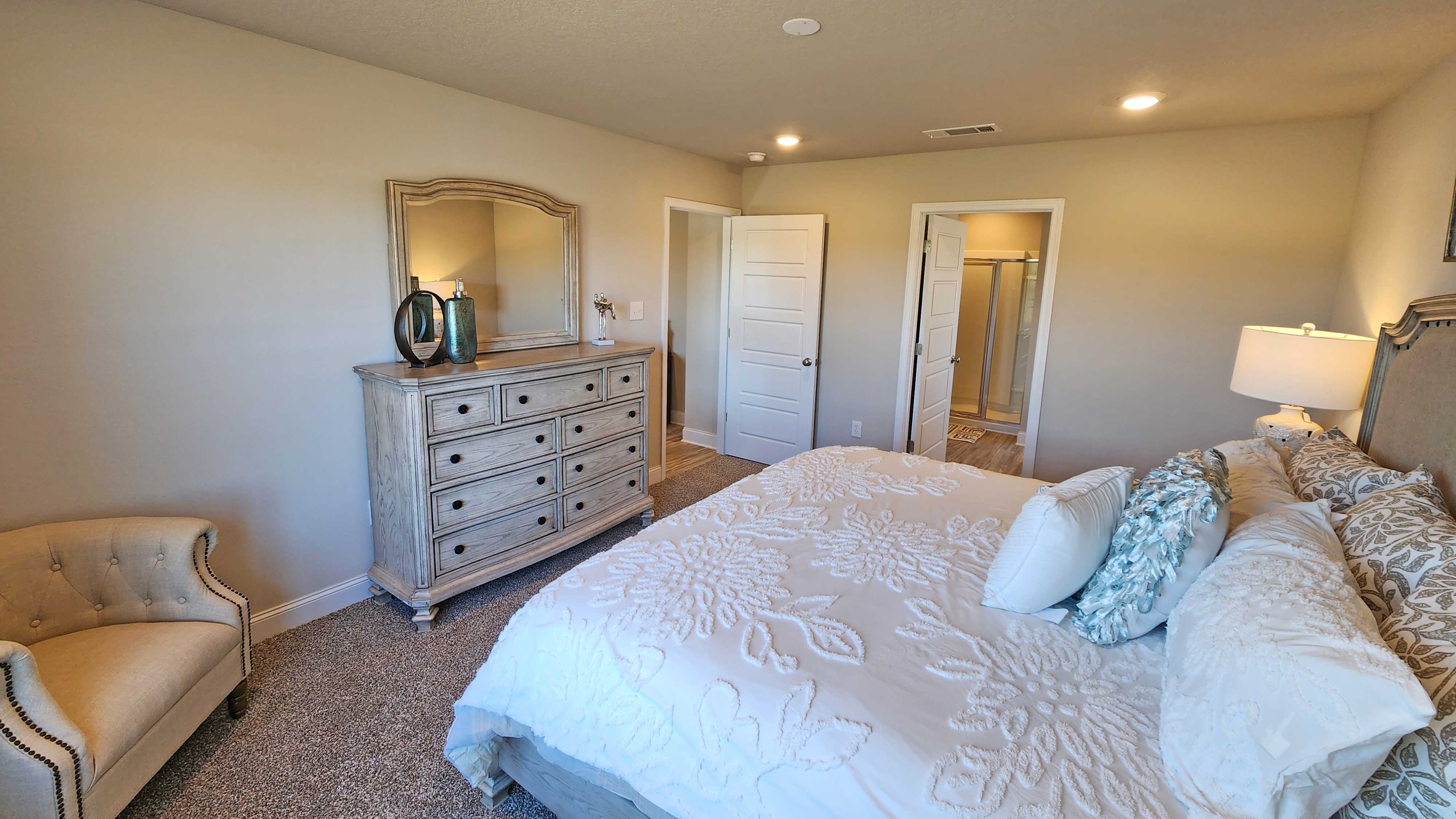 Primary bedroom with access to ensuite.