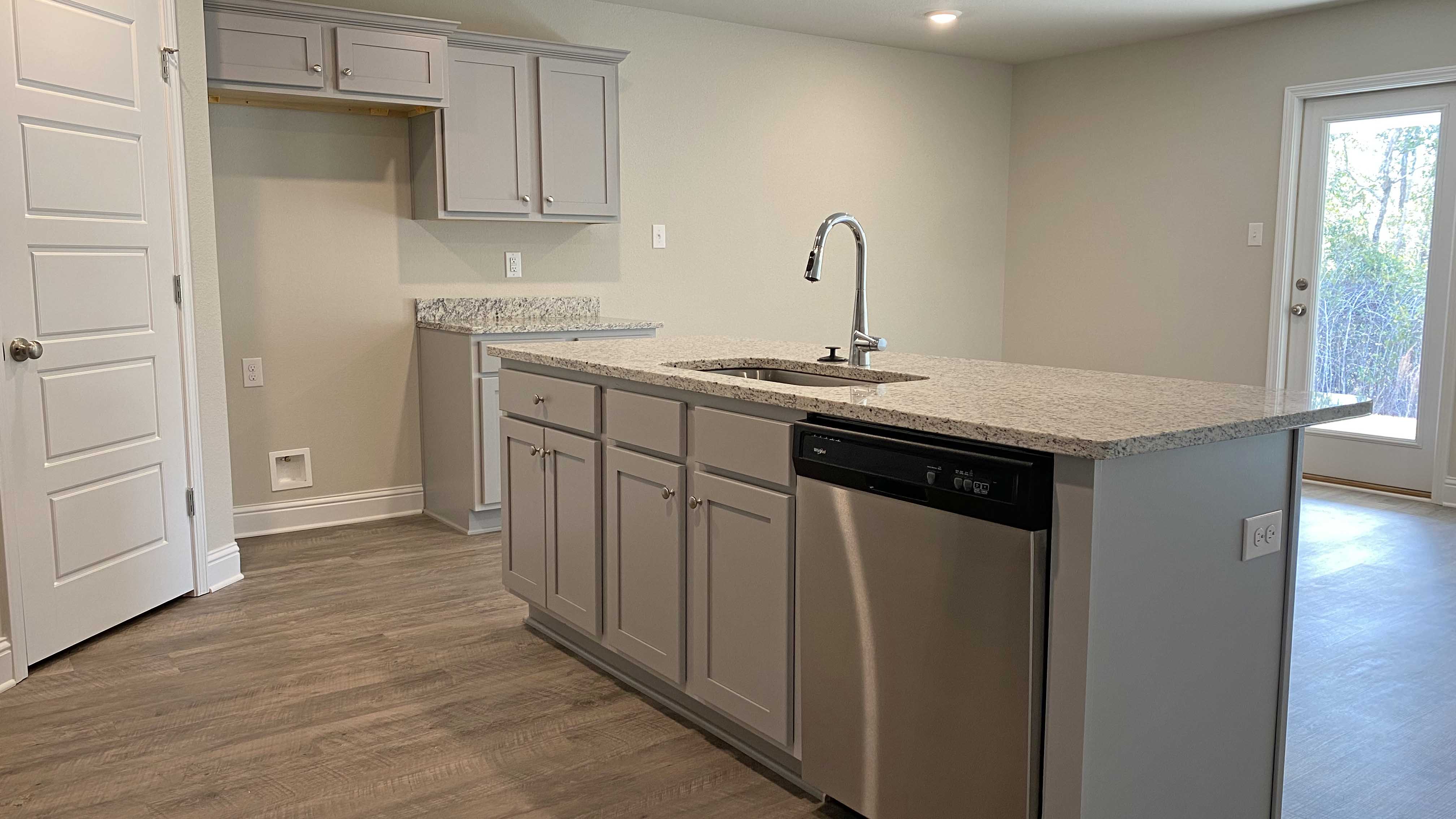 Stand alone island inside bright and airy kitchen