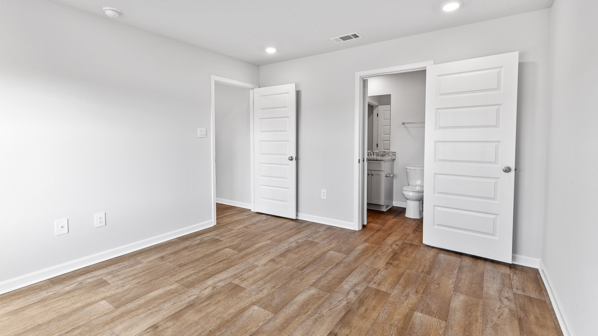 Spacious primary bedroom suite